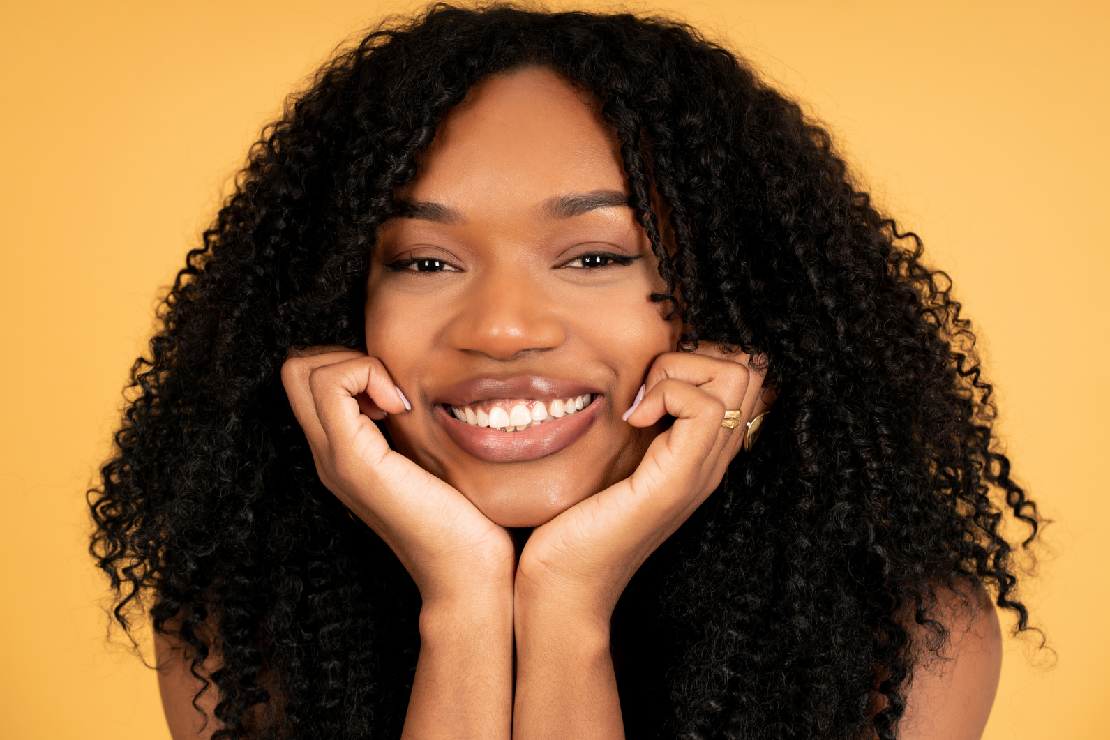 Close-up of a Young Afro Woman Smiling.